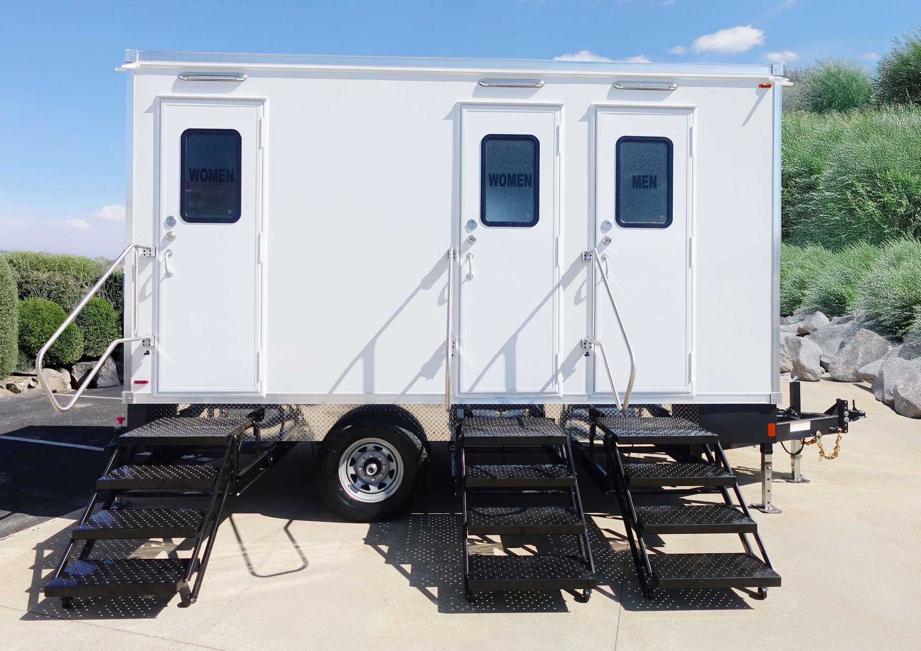 Exterior of Level Up Lavatories 3-station trailer with three entrances